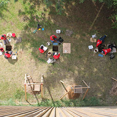 Colour photograph of an aerial view of the team during an archeological survey.
