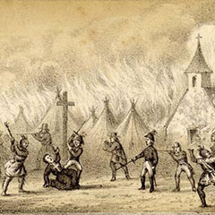 Illustration d'un père Jésuite agenouillé près d'une croix. Une cinquantaine d'hommes armés sont autour de lui. Le village derrière est en feu.